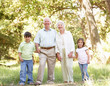 Grandparents In Park With Grandchildren
