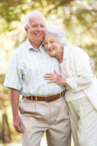 Photo: Senior Couple Walking In Park Senior Couple Walking In Park