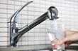 Filling glass of tap water Filling glass of tap water