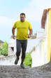 Middle age man running on a city road
