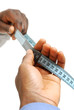 Photo: Hands using measuring tape Hands using measuring tape