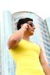 Attractive fit young businessman using a cell phone