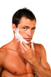 Sexy handsome young man with a shaving foam Sexy handsome young man with a shaving foam