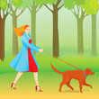 Beautiful ginger woman walking her dog in a park Beautiful ginger woman walking her dog in a park