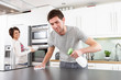 Photo: Young Couple Cleaning Cleaning Modern Kitchen Young Couple Cleaning Cleaning Modern Kitchen