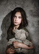 Sad little girl with toy