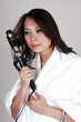 Girl curling her hair.