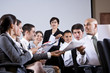 Detalii fotografie Group business presentation handing out papers