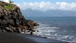 Black beach on the coast of Tahiti