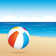 Beach ball bouncing on sand
