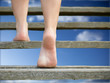 Shoeless feet going upstairs