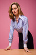 Authoritative woman in striped shirt
