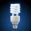 3d render of a glowing blue energy saving light bulb 3d render of a glowing blue energy saving light bulb