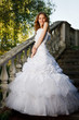 Bride posing on old stairs