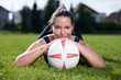 Attractive female with a football