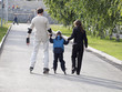 Productive leisure. The father and mother learn the son to go fo
