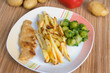 Hänchenschnitzel Wiener Art mit Pommes und Rosenkohl