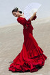 Traditional Woman Spanish Flamenco Dancer In Red Dress With Fan