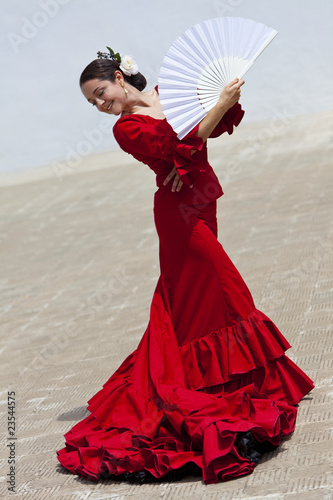 Photo: Traditional Woman Spanish Flamenco Dancer In Red Dress With Fan Traditional Woman Spanish Flamenco Dancer In Red Dress With Fan
