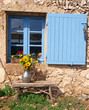Blue shutter with flowers in Provence