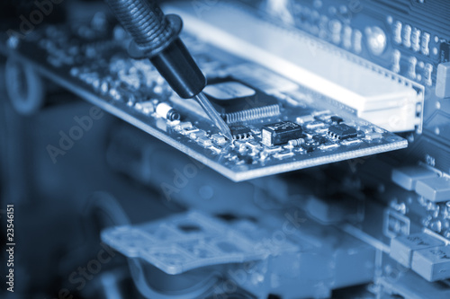 Photo: Electronics. Engineer at work Electronics. Engineer at work