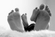 Close up of newborn and mother feet