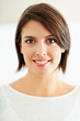 Portrait of a sweet young woman smiling