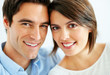 Closeup of a sweet young couple smiling together