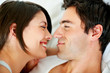 Happy young couple about to kiss each other