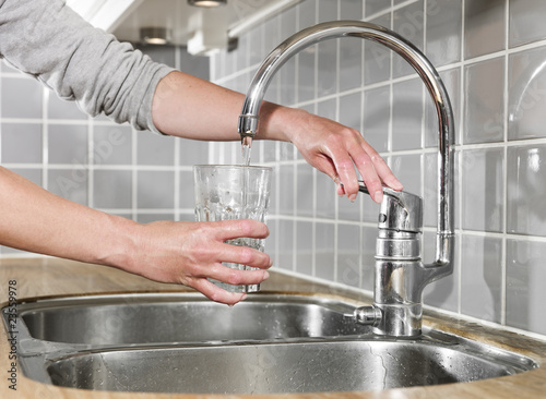 Photo: Filling a glass of water Filling a glass of water