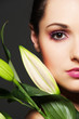 attractive woman with green flower