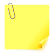 Yellow sticker with the curled corner and steel paper clip Yellow sticker with the curled corner and steel paper clip
