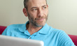 man and laptop smile