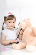 little girl doctor with teddy bear