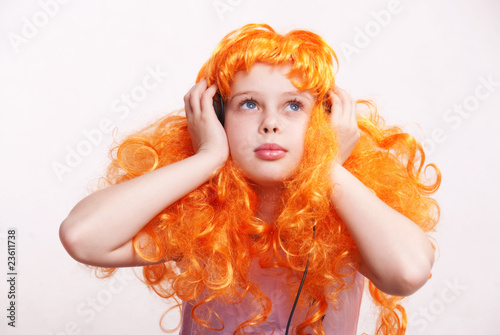 Photo: Redhead girl listen to music Redhead girl listen to music