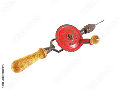 Photo: Old hand drill on a plain white background. Old hand drill on a plain white background.