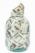 Many 100 US dollars bank notes in a glass jar Many 100 US dollars bank notes in a glass jar