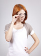 Young smiling businesswomen in white with glasses.
