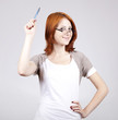 Young businesswomen with pen in hand