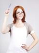 Young businesswomen with pen in hand