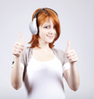 Girl with modern headphones show OK