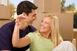 Lovely couple holding keys