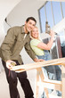 Happy couple doing home decoration