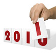 Photo: Hand holds calendar card for change of date Hand holds calendar card for change of date
