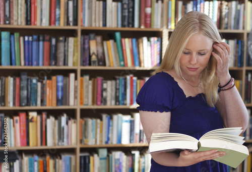 Photo: Blonde bookreader in study Blonde bookreader in study