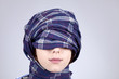 Modent girl with scarf around head, Studio shot.