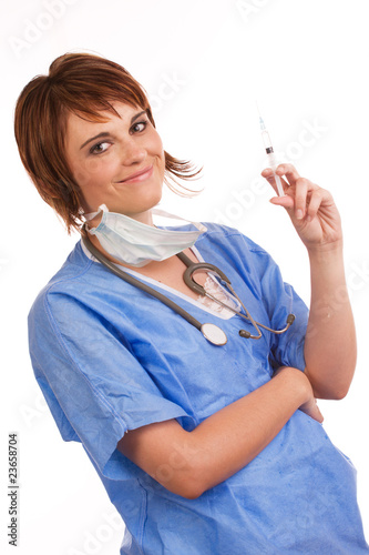 Foto: Young female nurse holding filled syringe Young female nurse holding filled syringe