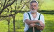 Portrait of a senior man gardening in his garden