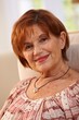Portrait of attractive elderly woman at home