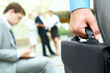 Hand with briefcase